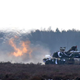 A U.S. Army tank joins the action during their exercise with Polish Army soldiers on training fields in Zagan, Poland, Monday, Jan. 30, 2017. (AP Photo/Krzysztof Zatycki)